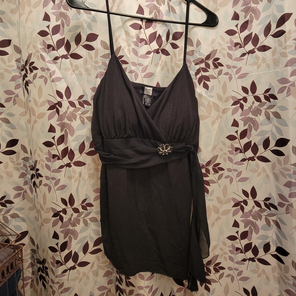 String top ,black with sparkles in the material, cute metal brooch,